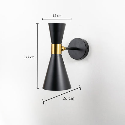 Black and gold wall sconce displayed with measurements showing a height of 27 cm width of 12 cm and projection of 26 cm on a simple white background.