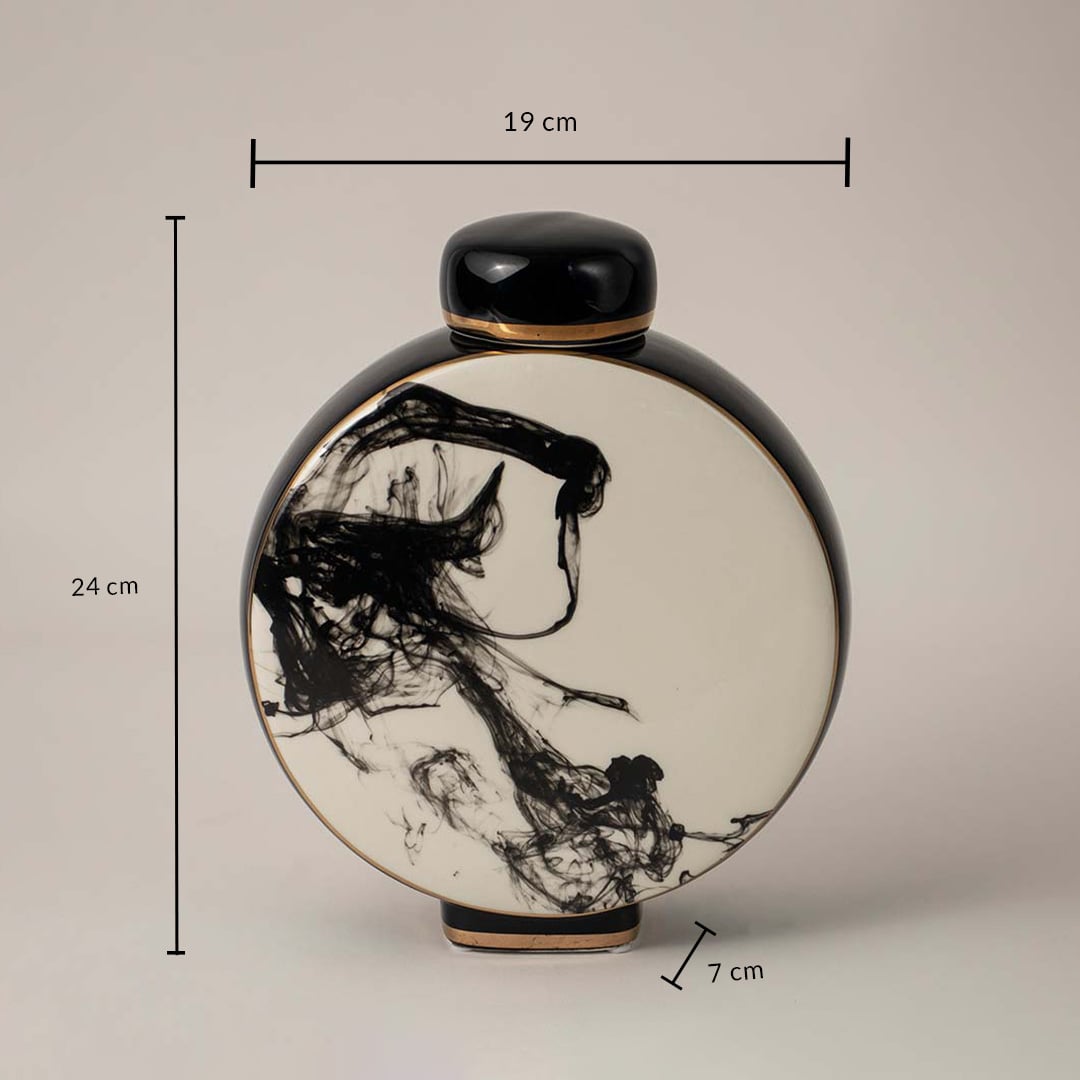 Black and white ceramic vase with abstract ink design showing 24 cm height 19 cm width and 7 cm depth on white background.