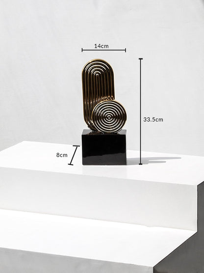 Gold metal decorative sculpture with black base showing height 33.5cm width 14cm base 8cm for table decor.