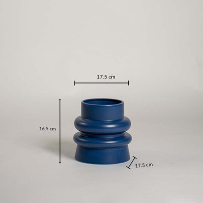 Deep blue ceramic vase with modern layered body measuring 17 cm width 16 cm height and 17 cm base shown clearly on a studio background.