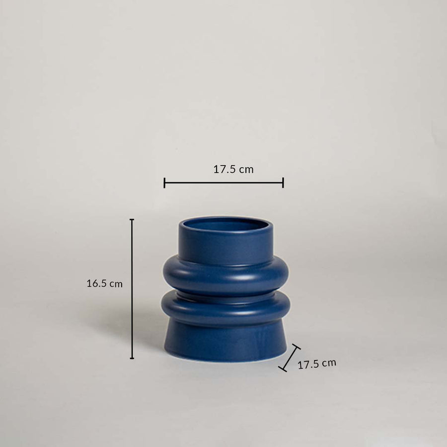 Deep blue ceramic vase with modern layered body measuring 17 cm width 16 cm height and 17 cm base shown clearly on a studio background.