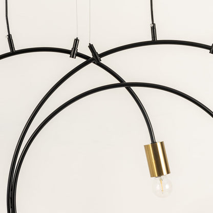 A closeup view of the chandelier showing the smooth black metal arcs and gold bulb holders highlighting premium craftsmanship and modern design details.