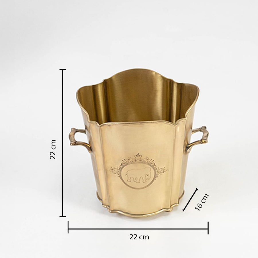 Gold planter with curved top and handles shown with size labels 23 cm height 27 cm width and 22 cm depth on white background.