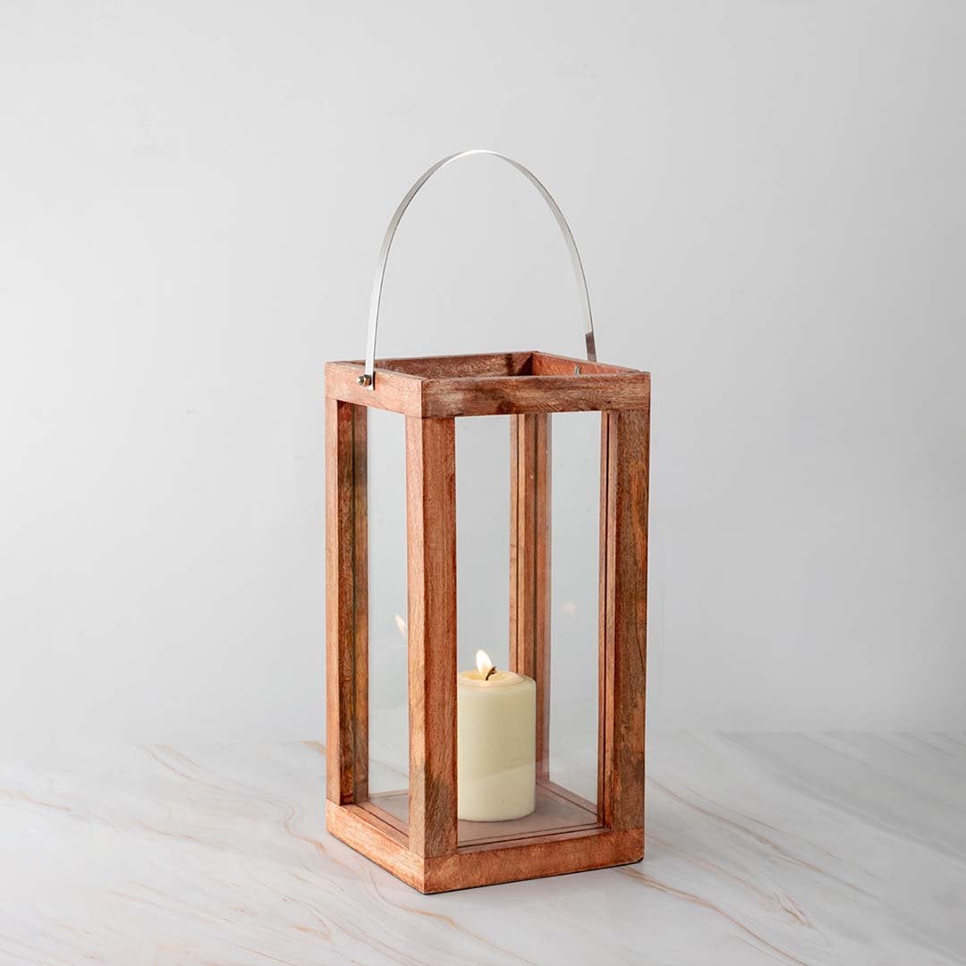 Wooden lantern candle lit placed on a white background emphasizing its elegant natural wood texture.
