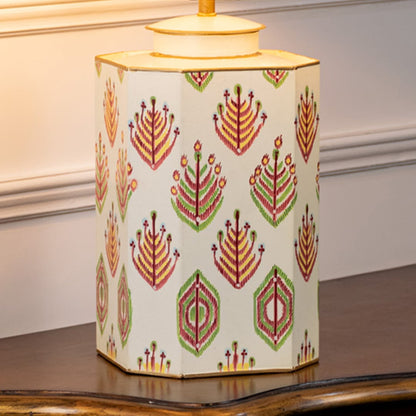 Table lamp closeup highlighting patterned ceramic base with symmetrical leaf motifs and fine handcrafted detailing.