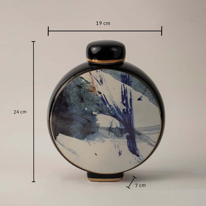 Black ceramic vase with blue abstract brush design showing 24 cm height 19 cm width and 7 cm depth on white background.
