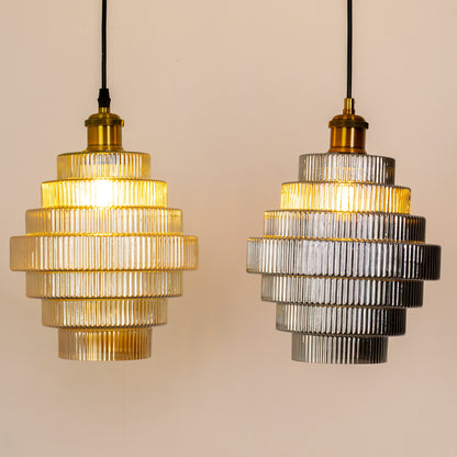 Grouped display of tiered glass pendant lights showcasing the layered ribbed design and elegant modern style for coordinated décor settings.