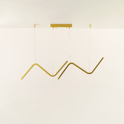 Gold wave LED chandelier featuring curved LED bars creating warm ambient illumination perfect for luxury dining rooms and high end interior lighting design.