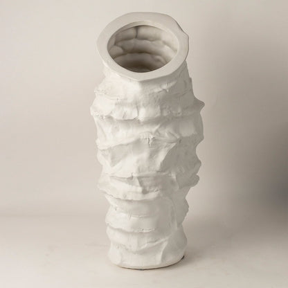 Eclipse white ceramic vase displayed on a plain background showcasing its tall handcrafted layered design and artistic matte texture.