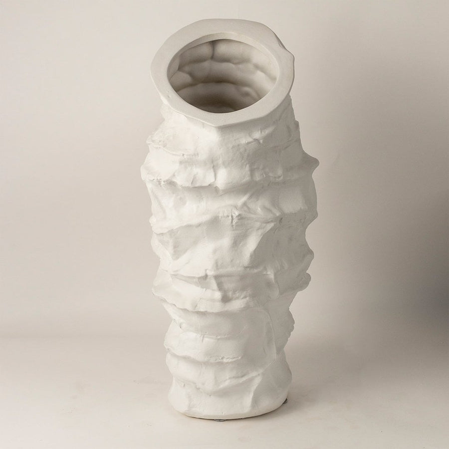 Eclipse white ceramic vase displayed on a plain background showcasing its tall handcrafted layered design and artistic matte texture.