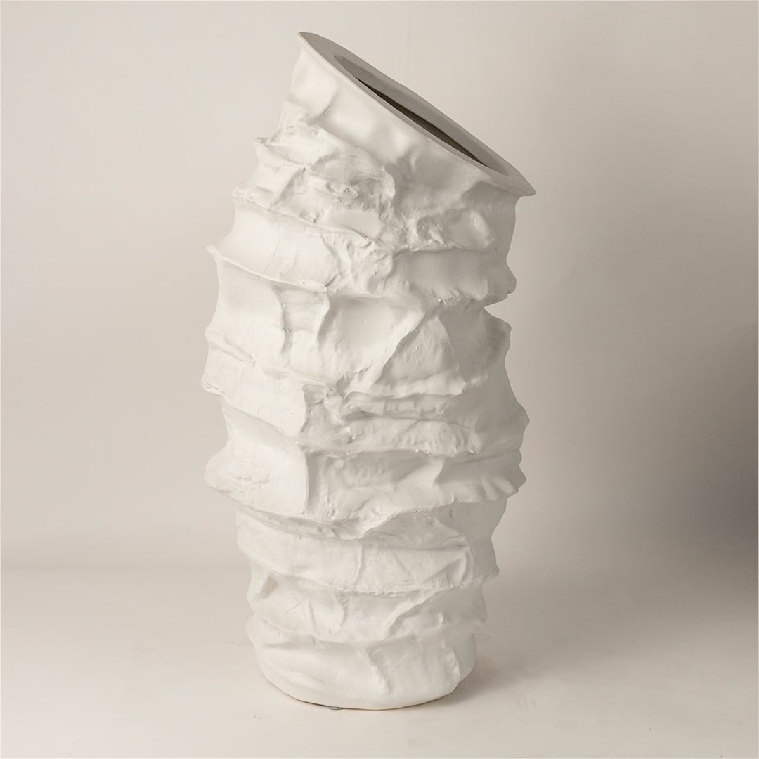 Side view of Eclipse ceramic vase revealing its uneven handcrafted layers and organic tall profile ideal for luxury decor styling.
