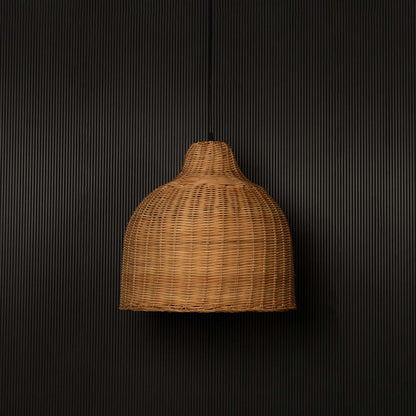 Dome-shaped rattan pendant light with natural bamboo weave shade turned off against plain black background.