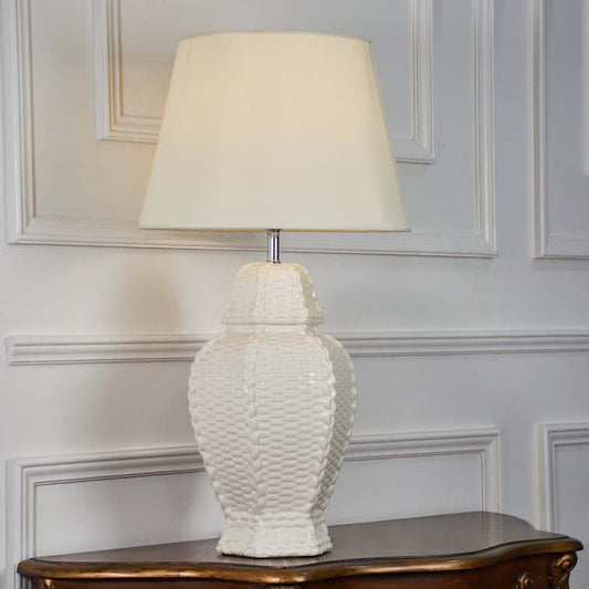 White textured glass table lamp with fabric shade designed for sophisticated traditional decor and ambient table lighting indoors.