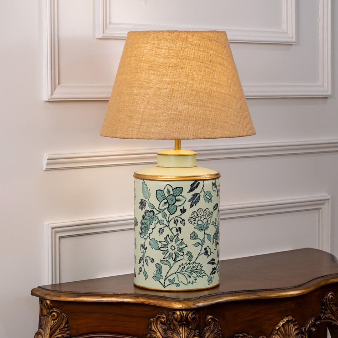Wild Roses patterned light illuminated on white background showing floral detailing soft light diffusion and charming interior decor style.