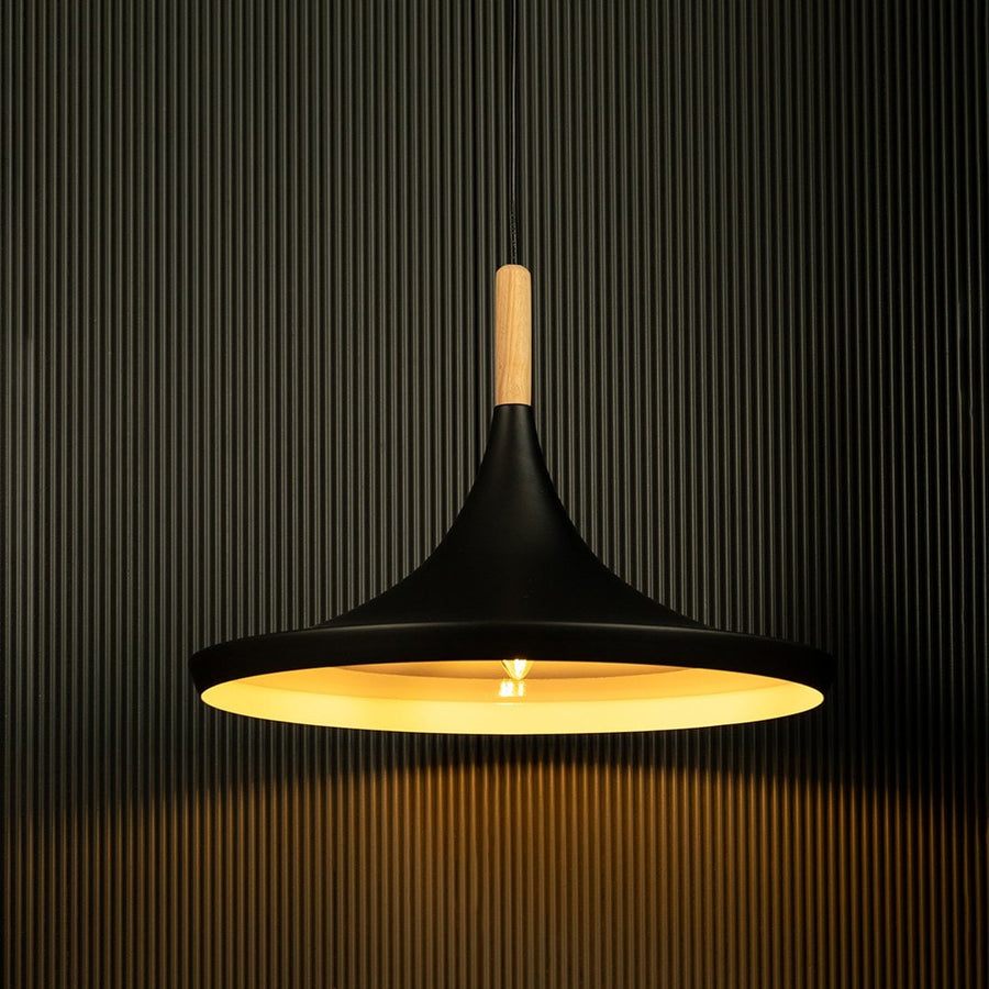 Colorful pendant lights shining against a black backdrop showcase their smooth finish and wooden accents.