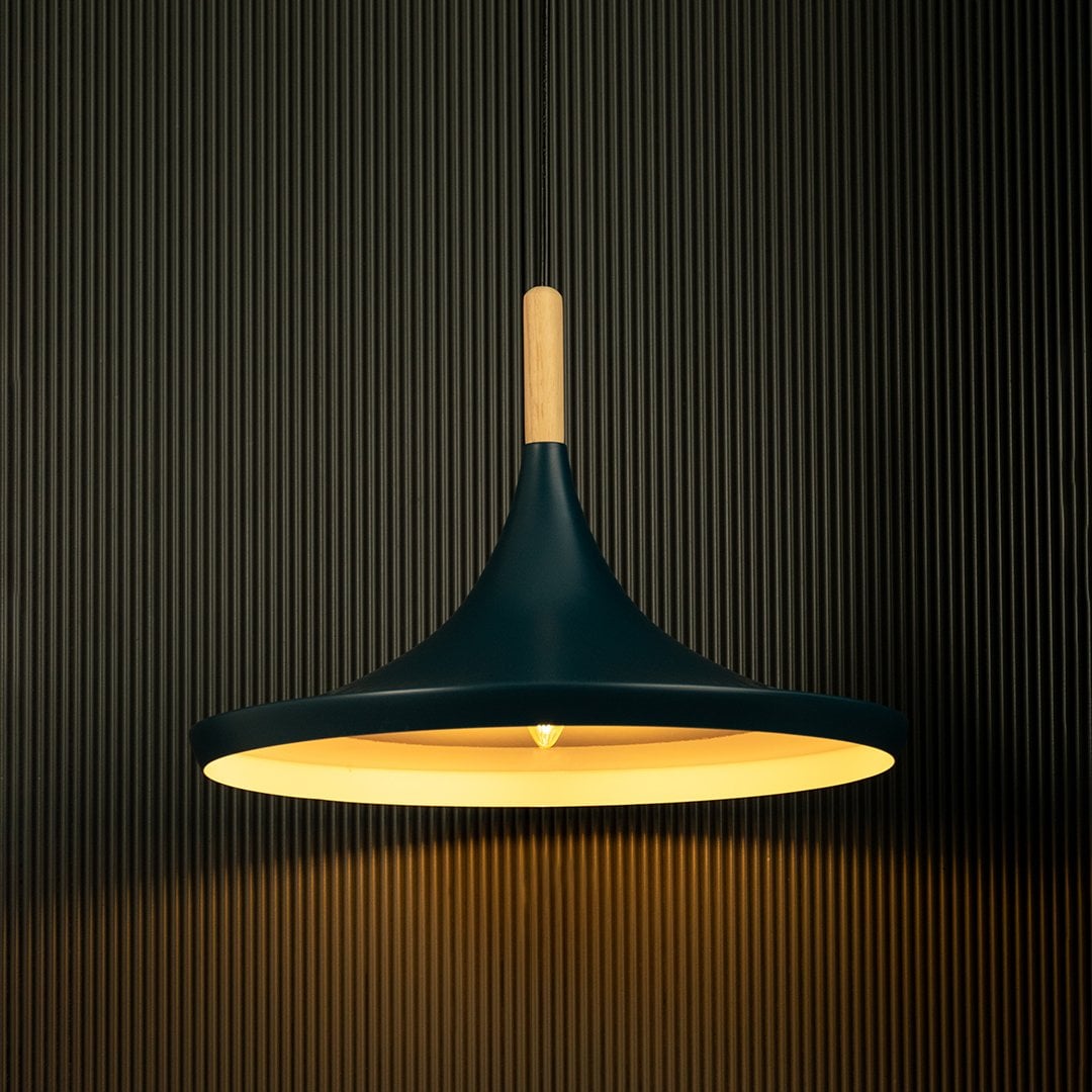 Blue pendant light shining against a dark background showcases its elegant design and natural wooden details.