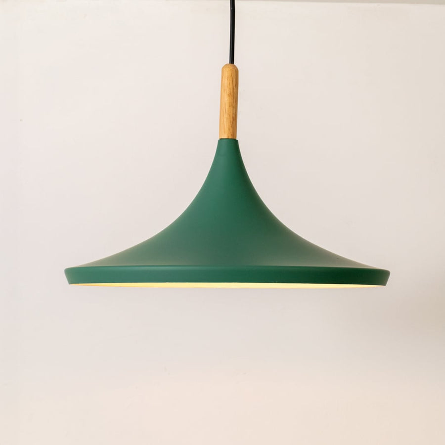 Green wide shade pendant light with wood detail on white background showcasing Scandinavian style appeal.