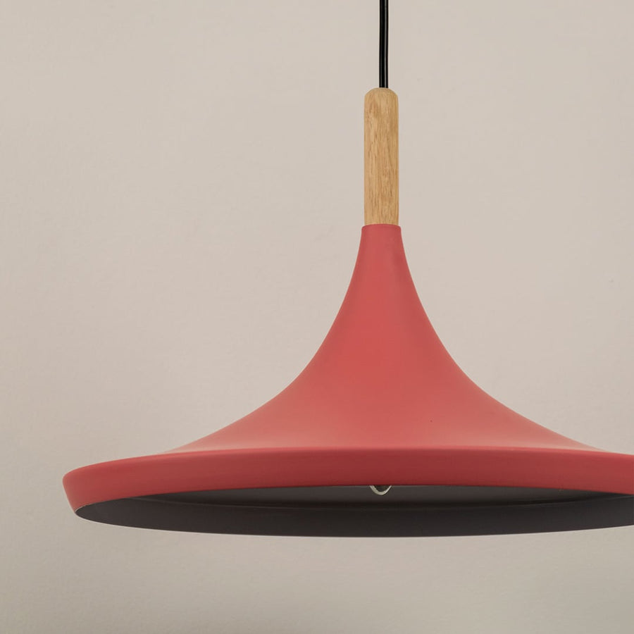 Close-up of the pink pendant light with a wooden detail focusing on its clean modern design and soft matte finish.