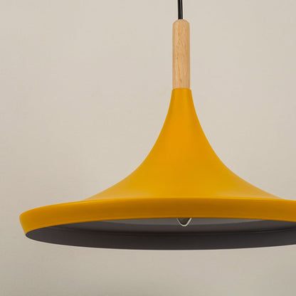 Close up of a yellow pendant light with a wooden accent showcasing its smooth matte finish and modern design.