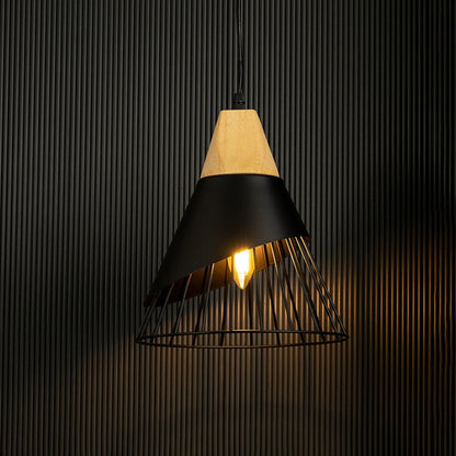 Pendant light with wooden top and black wire cage glowing softly against a black background highlighting its sleek design and lighting effect.