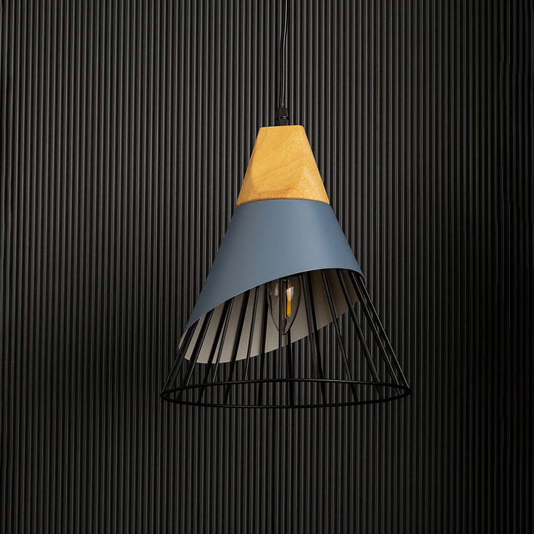 Pendant light with a wooden top and black wire cage displayed without light against a dark background to emphasize its design.