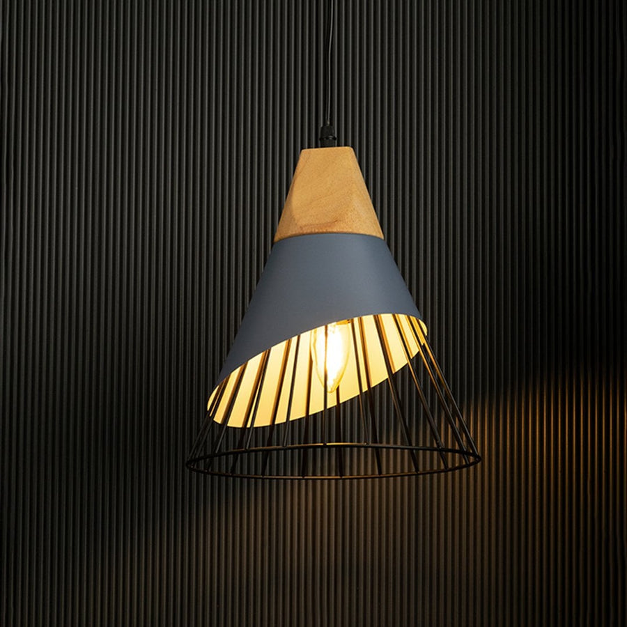 Pendant light with wooden accents and a black wire cage glowing softly against a black background highlights its minimalist design.