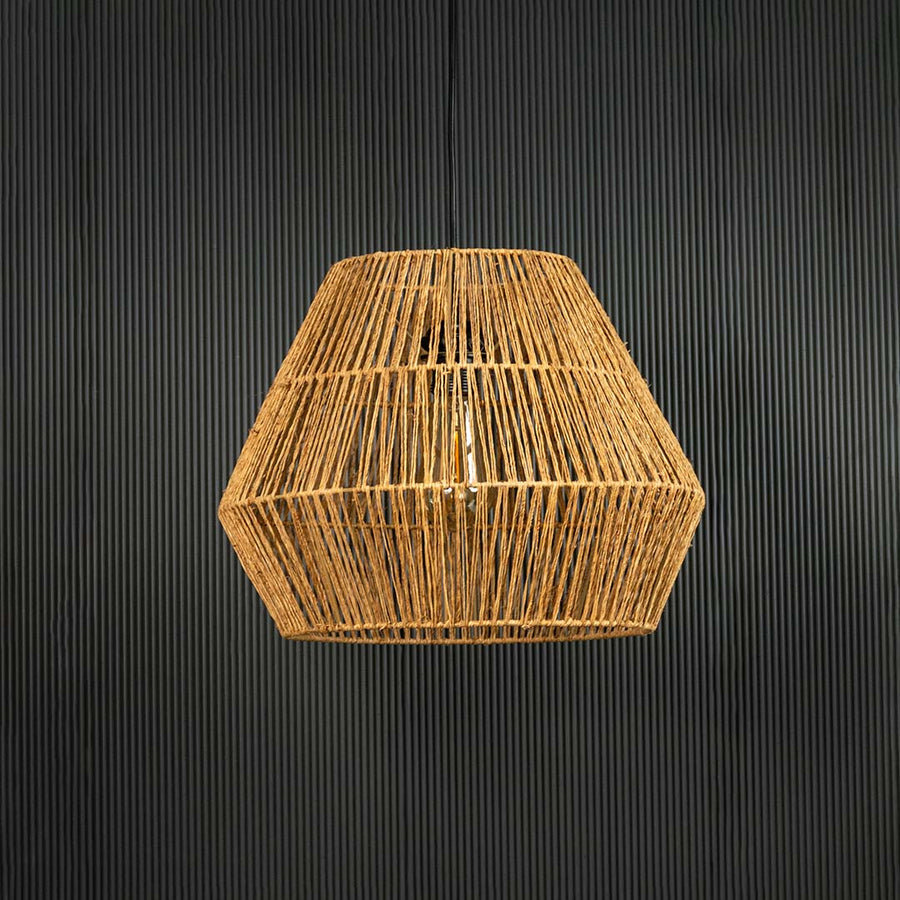 Natural jute pendant ceiling light switched off on back background for rustic bohemian dining and living room decor.