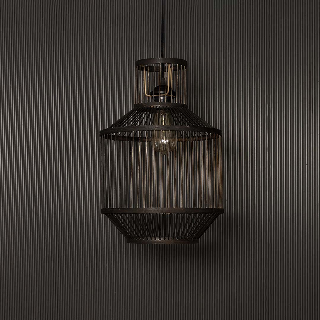 Industrial wire pendant light on dark background emphasizing its matte metal finish and modern craftsmanship.