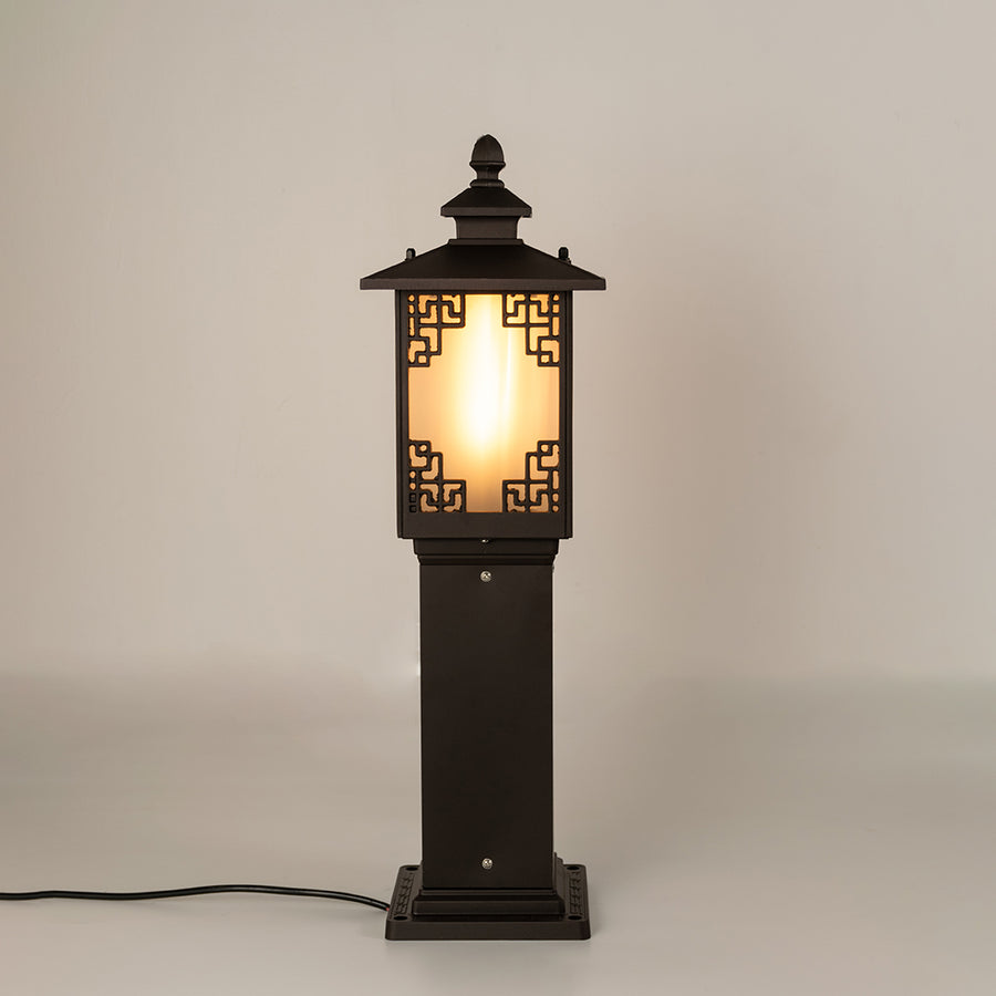 Vintage black outdoor gate light with warm glowing panels for luxury exterior decor styling use.