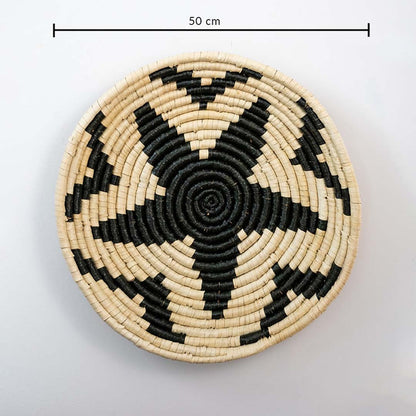 Round handcrafted wall basket with bold star pattern in black and natural tones showing 30 cm diameter for wall decor use.