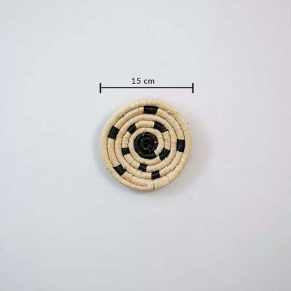 Small circular woven wall basket in natural and black tones showing 15 cm diameter ideal for compact wall decor styling.