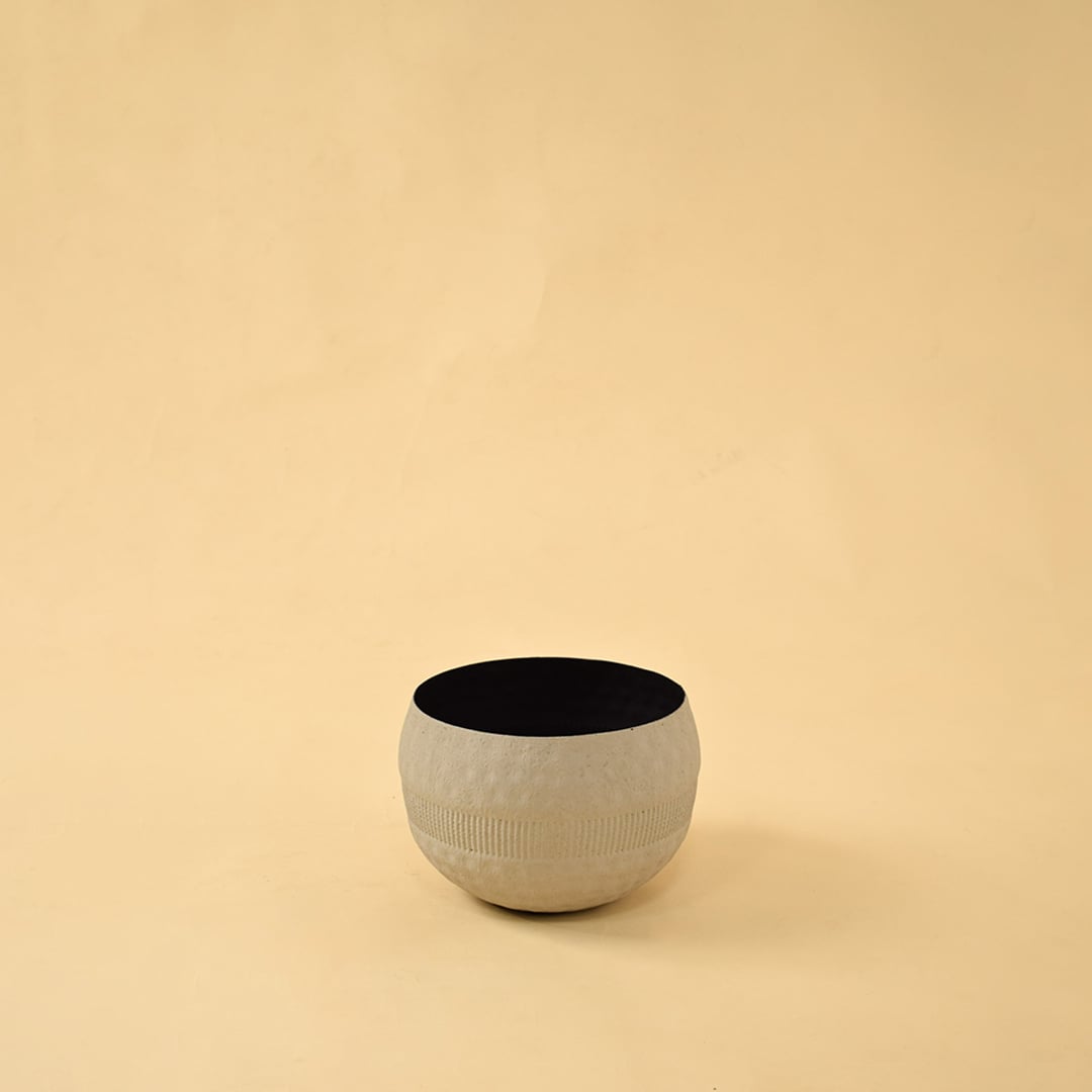 Cream round textured pot with matte black interior displayed on a clean white background for simple minimal home decor.