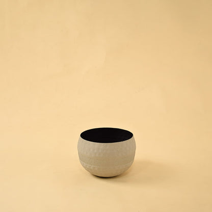 Cream round textured pot with matte black interior displayed on a clean white background for simple minimal home decor.