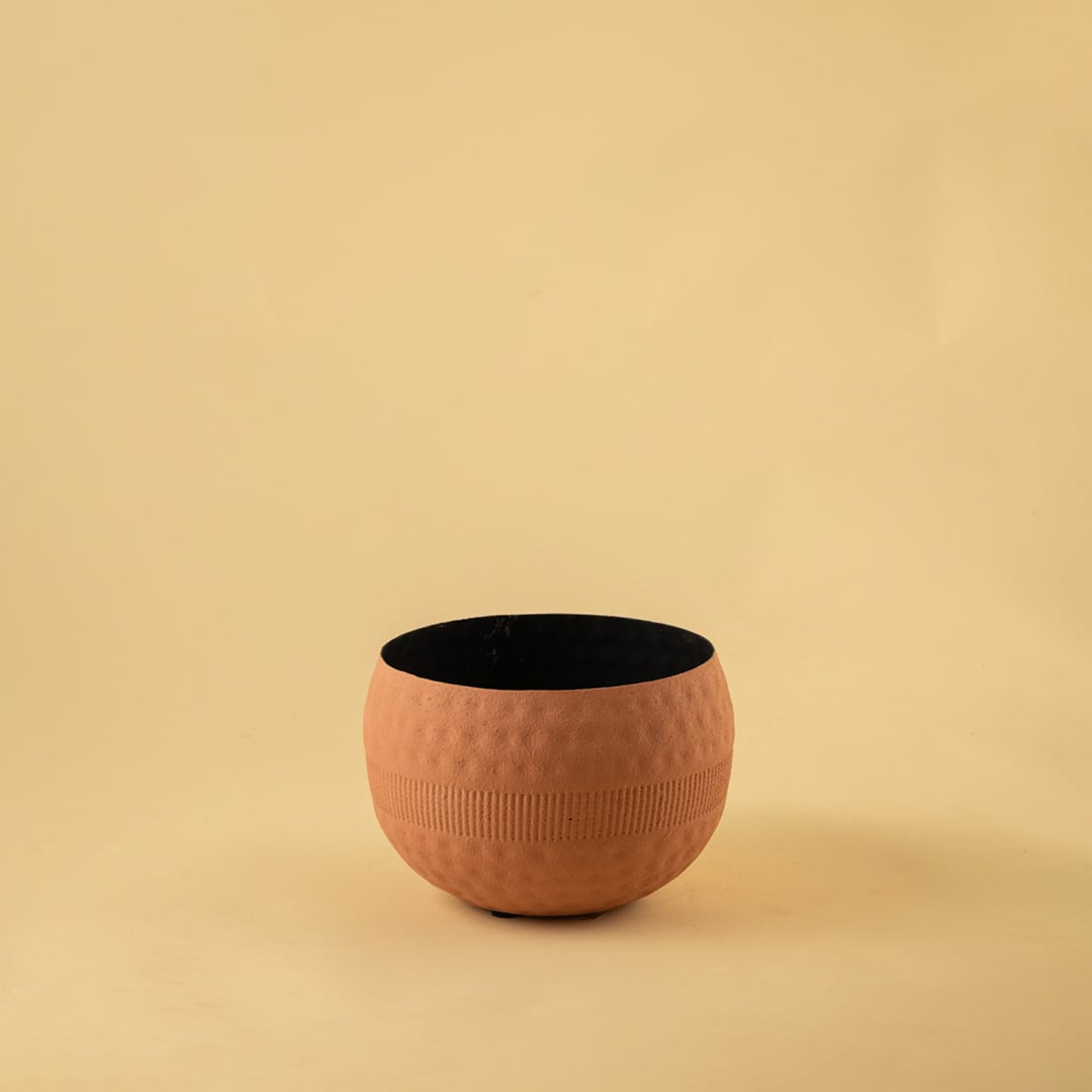 Terracotta textured planter bowl with a rounded shape and black interior photographed on a plain light background for a clean product display