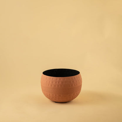 Terracotta textured planter bowl with a rounded shape and black interior photographed on a plain light background for a clean product display