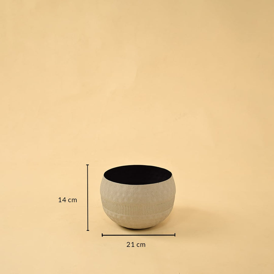 Cream round textured pot with black interior shown with 21 cm width and 14 cm height for modern decorative home styling.