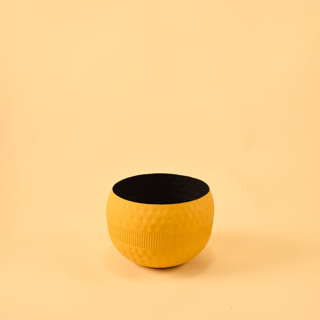Yellow round textured pot with ribbed design and matte finish displayed on a clean white background for minimal modern decor.