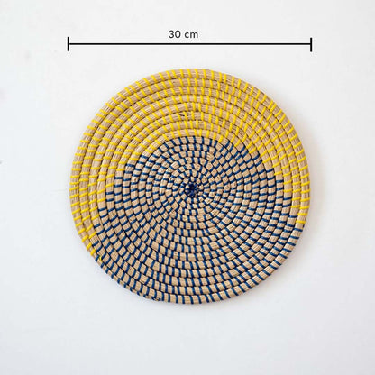 Round handcrafted wall basket in yellow blue and natural fiber showing 30 cm diameter suitable for modern wall decor use.