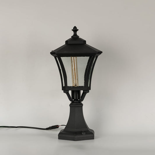 Black outdoor gate light with clear textured glass panels for stylish exterior decor use.