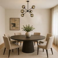 Designer chrome glass chandelier with geometric frame enhancing dining areas living rooms and modern luxury interior spaces.