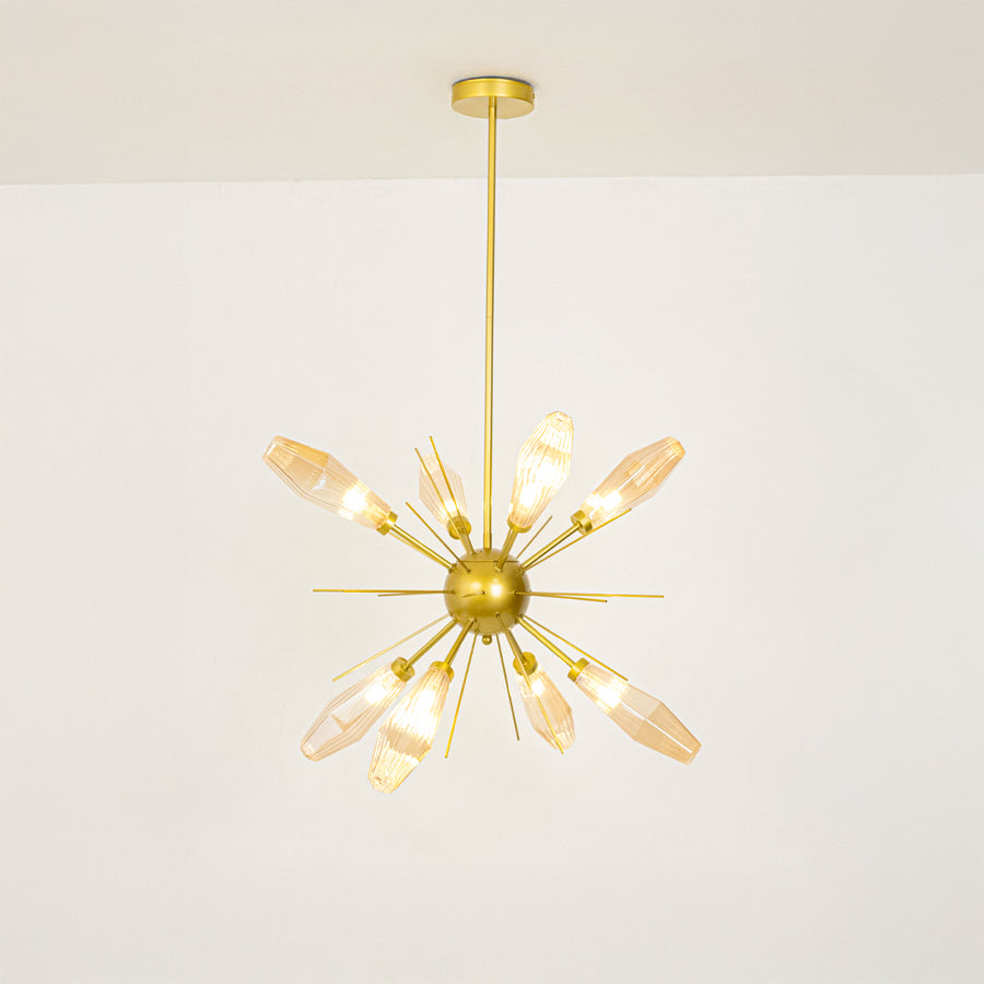 Gold metal starburst chandelier with illuminated crystal accents offering sophisticated contemporary ceiling lighting indoors.