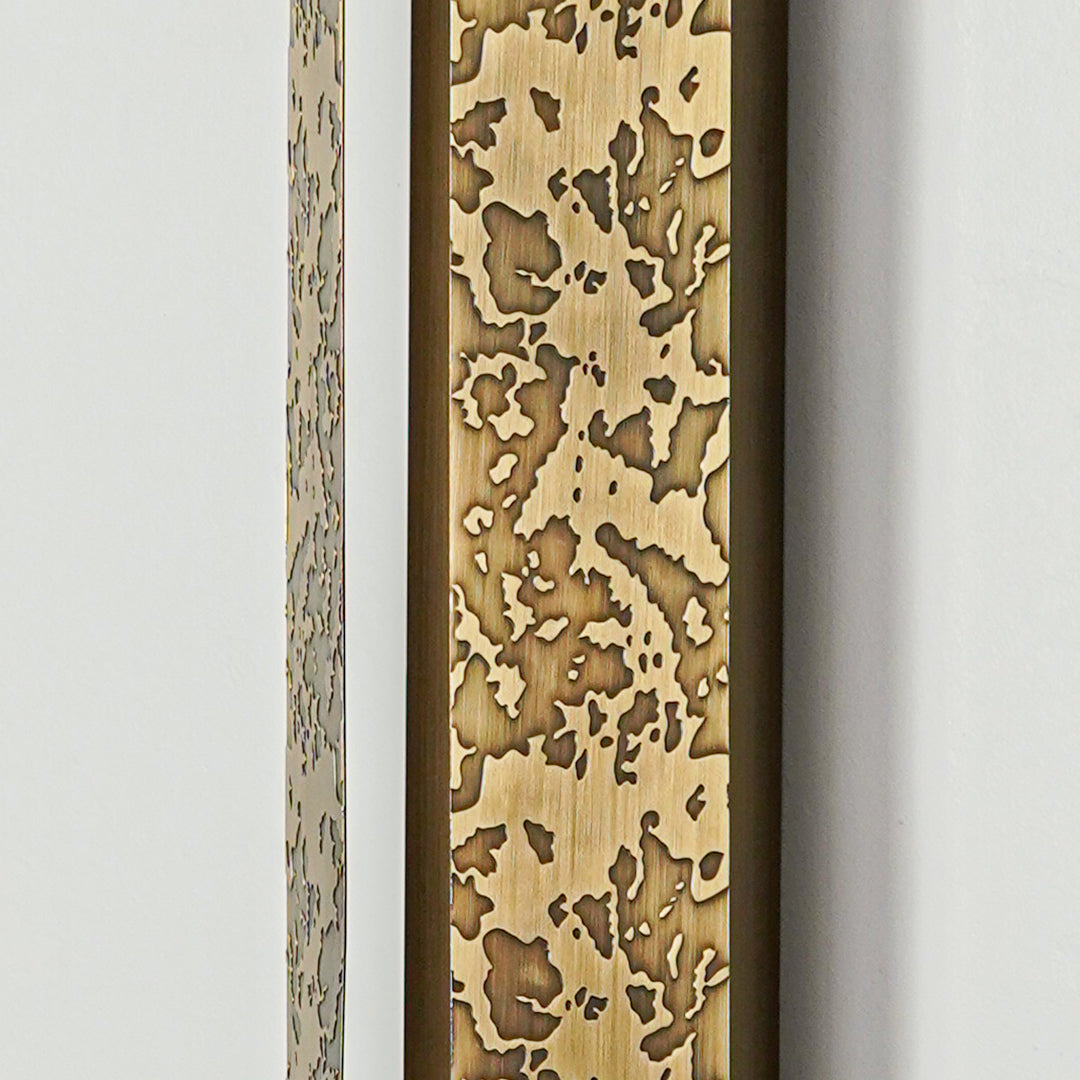 Close view of gold wall sconce with intricate textured metal detailing showcasing premium craftsmanship for elegant home lighting.