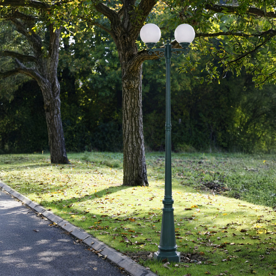 Vintage outdoor street lamp styled beside pathway and trees for elegant garden decor ambiance.