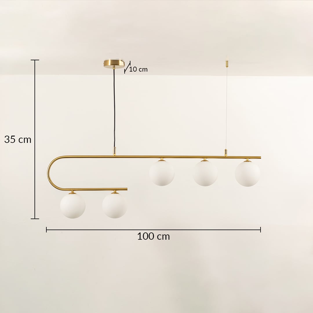 Gold chandelier light with white globe bulbs in a front view measuring 100 cm width and 35 cm height against a plain background with lights on ideal for luxury contemporary lighting décor.