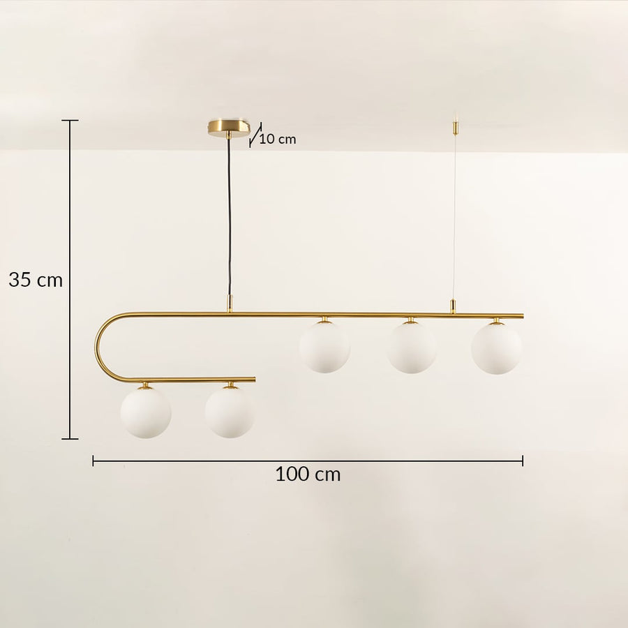 Gold chandelier light with white globe bulbs in a front view measuring 100 cm width and 35 cm height against a plain background with lights on ideal for luxury contemporary lighting décor.