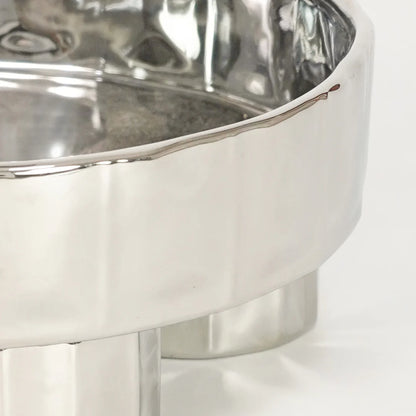 Closeup image of ribbed glass serving bowl with footed base for elegant dining table decor styling and modern home dining.