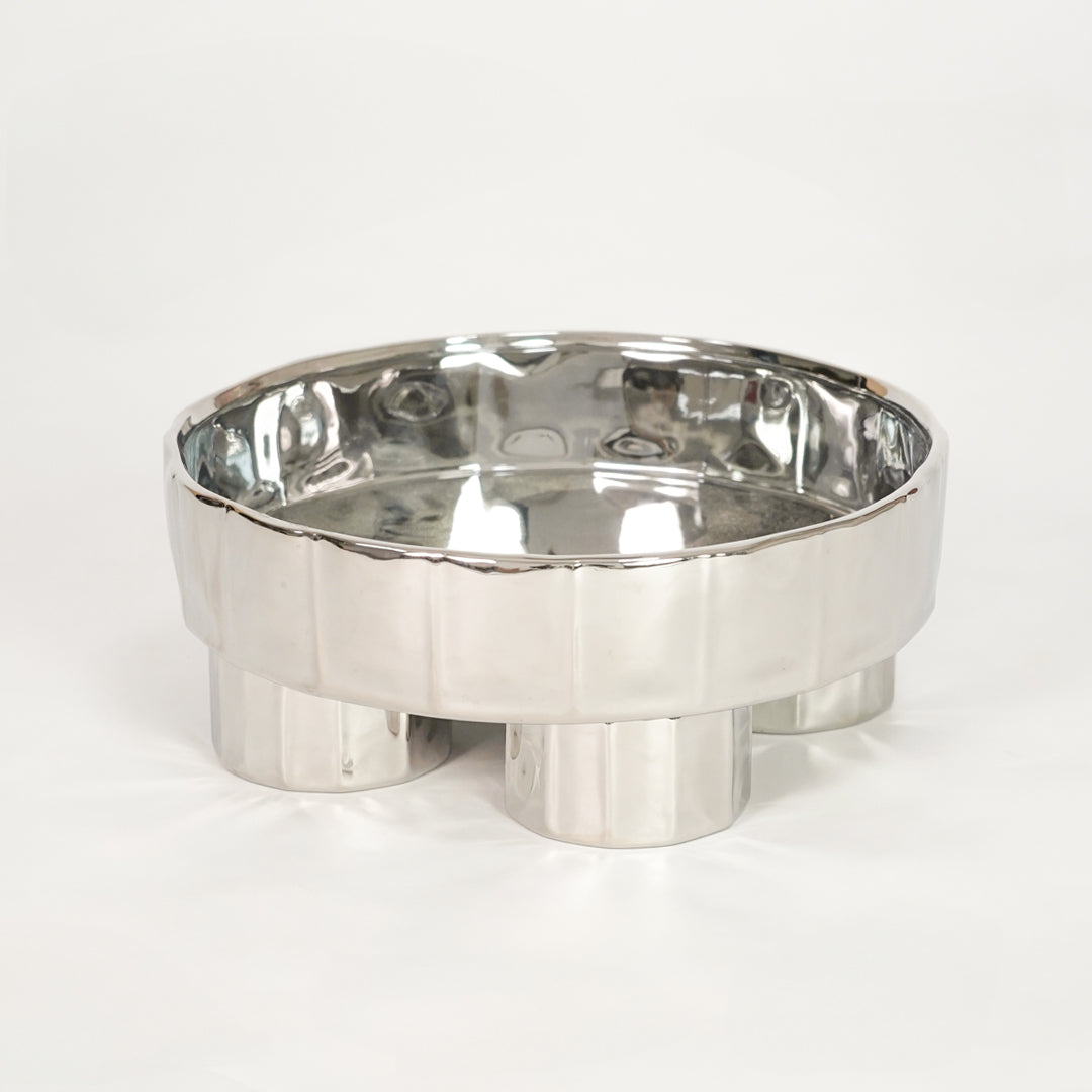 White background image of silver metal decorative bowl for modern tabletop decor styling with polished finish.