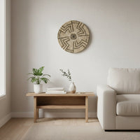 Natural woven wall basket displayed above a wooden bench for elegant bohemian wall decor and modern home interiors.