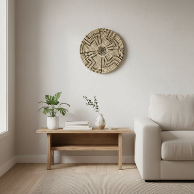 Natural woven wall basket displayed above a wooden bench for elegant bohemian wall decor and modern home interiors.