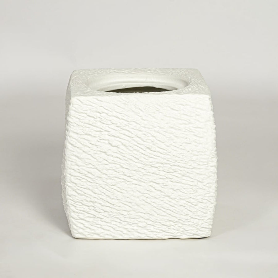 White decorative textured ceramic planter on white background modern home decor accent piece for table floor console styling.